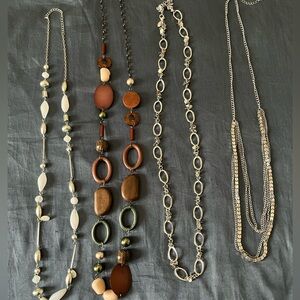Elegant Silver and Brown Necklace lot
4 necklaces